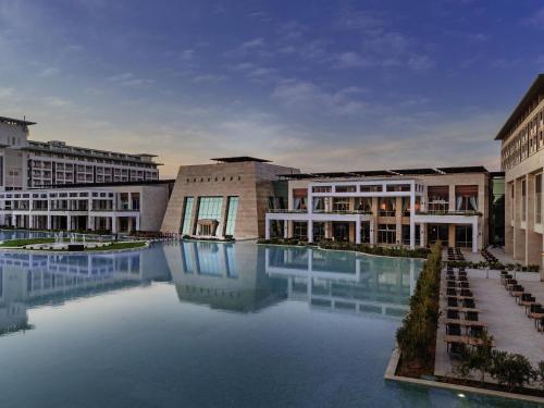 a group of buildings with a large pool of water at Rixos Premium Belek - The Land of Legends Access in Belek