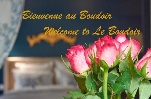 a vase of flowers with a sign that says welcome to le bouquet at Le Boudoir in Troyes