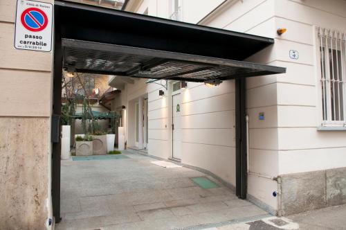 a building with awning on the side of it at Villa Maria in Turin