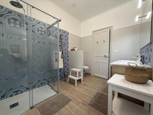 a bathroom with a glass shower and a toilet at Gure gostuan in Itxassou
