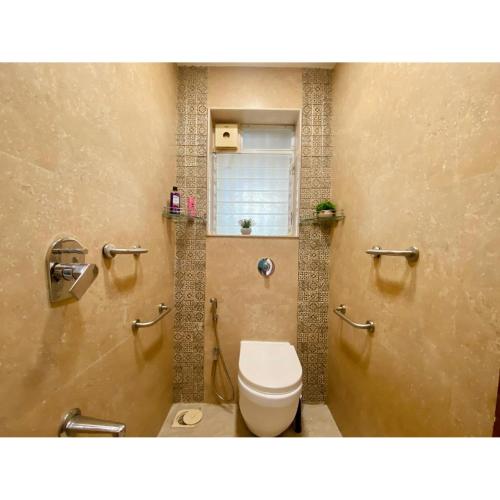a bathroom with a toilet in a stall at Modern 2bed Bandra AreaParkingUnit 2 in Mumbai