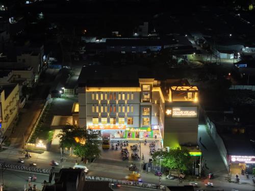an aerial view of a city at night at Hotel Grand Vekasa in Salem