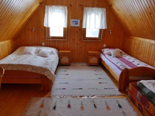 Postel nebo postele na pokoji v ubytování Dom z widokiem na Tatry