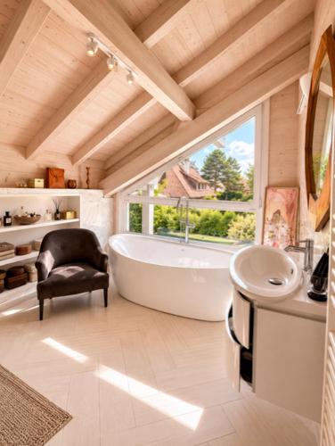 a bathroom with a tub and a sink and a window at Modern chalet next to Geneva in Divonne-les-Bains