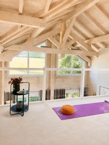 a room with a purple yoga mat on the floor at Modern chalet next to Geneva in Divonne-les-Bains