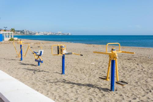 a row of volley ball courts on the beach at Carvajal Luxury Apartments - Free Parking in Fuengirola