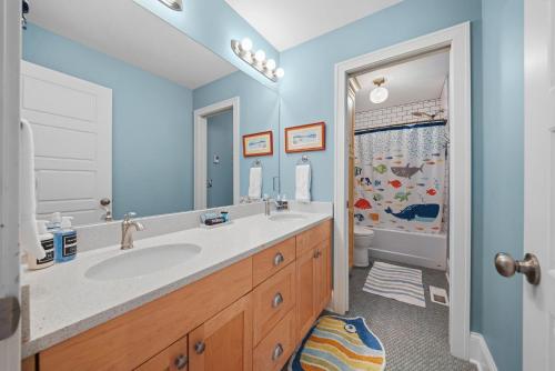 a bathroom with a sink and a shower at Casa Roja in Edina