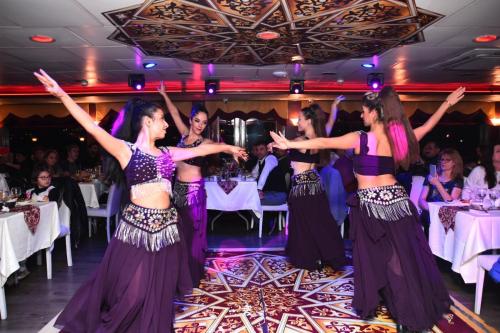 a group of dancers on the dance floor at a wedding at BOSPHOROUS DİNNER CRUISe in Istanbul