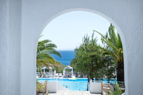 a view of the ocean from the pool at a resort at Bianco Olympico Beach Resort by Anayia All Inclusive Resorts in Vatopedi