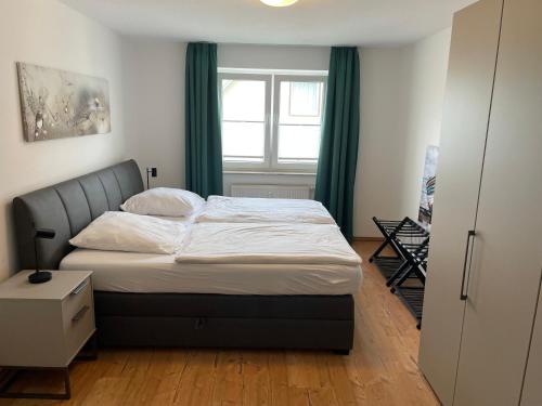 a bedroom with a bed and a window at Ostseetraum Usedom in Zempin