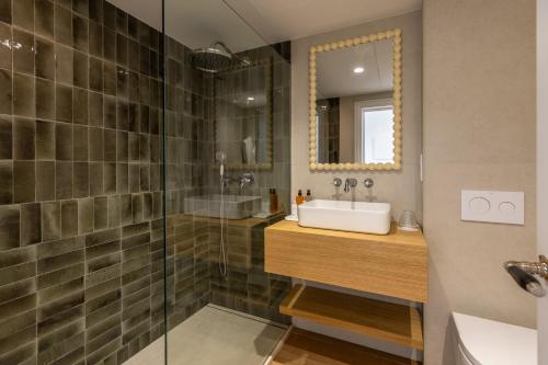 a bathroom with a sink and a shower at Hoposa Panorama in Port de Pollensa