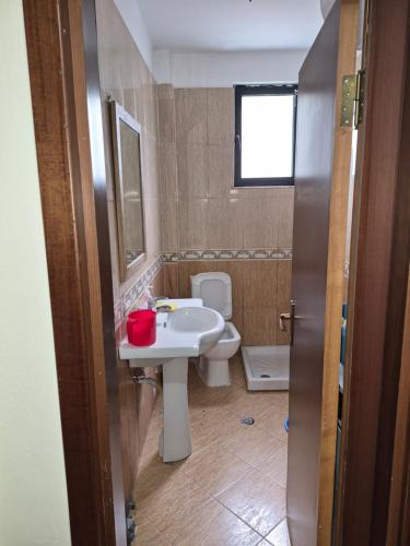 a bathroom with a sink and a toilet at Holiday Apartment 70meters from the sea in (( Stan i Ri ))