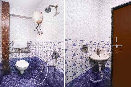 a bathroom with a toilet and a sink at FabHotel Aarvi Inn in Aurangabad