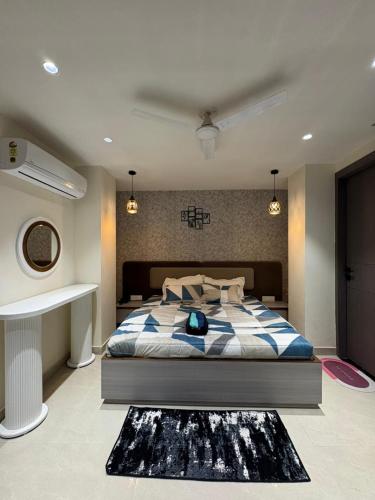 a bedroom with a large bed in a room at Jsrcozystays in Rājpur