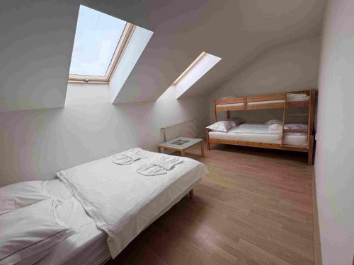 a bedroom with a bed and a bunk bed at Apartmány Puerto in Senec