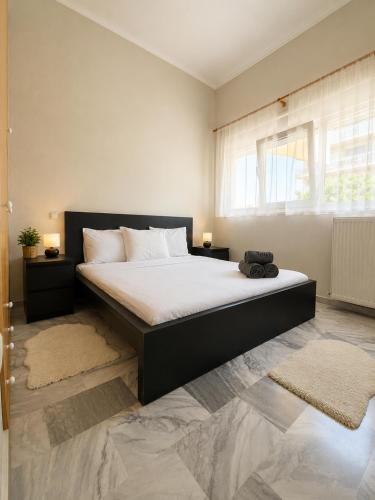 a bedroom with a large bed in a room at Asana by Agora Flats in Thessaloniki