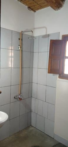 a bathroom with a shower and a sink at Pacha Wasi in Humahuaca