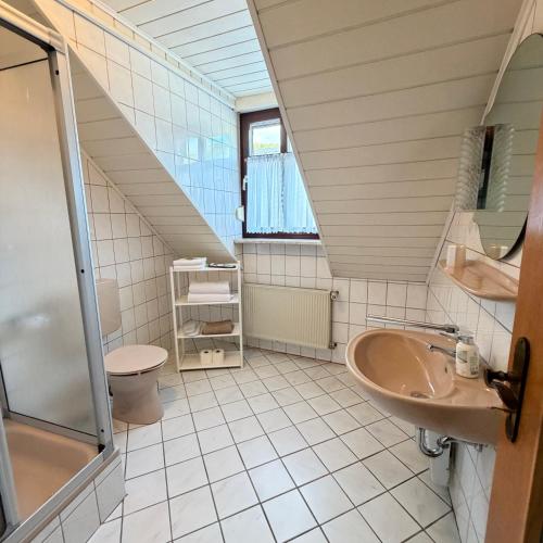 a bathroom with a sink and a toilet at Winzerhaus St Joseph in Piesport