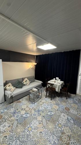 a room with a bed and a table in it at Luxury Estudio CH&H in Benalmádena