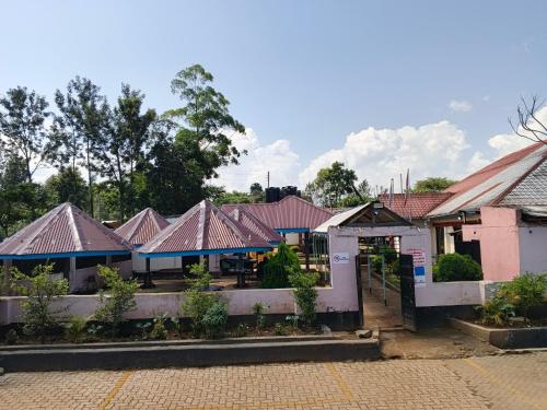 a row of houses with roofs at Chwele Premier Resort in Bungoma