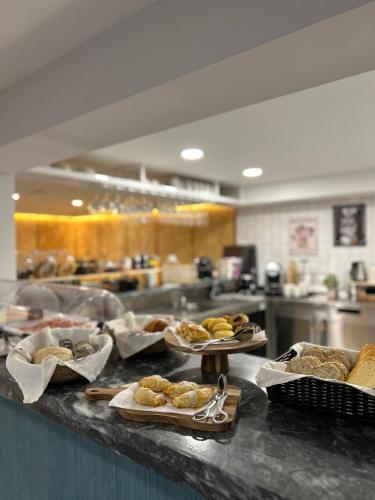 a kitchen with several plates of food on a counter at Alma Candida 25 in Azenhas
