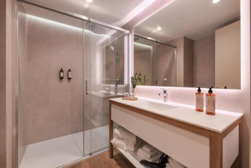 a bathroom with a sink and a shower at Valentin Sancti Petri in Chiclana de la Frontera