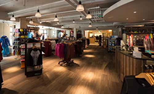 a clothing store with clothes on display in a room at The Blake at Taos Ski Valley in Taos Ski Valley