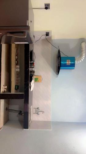 a machine with a light on the side of a room at Tranquility Apartment in Pokhara
