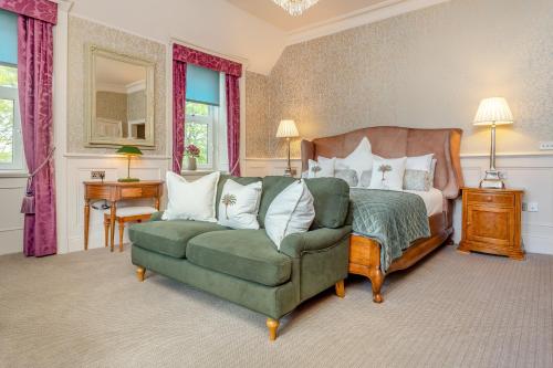 a bedroom with a bed and a couch and a chair at Muckrach Country House in Skye of Curr