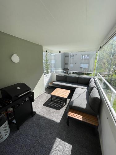 a living room with a couch and a table at Spacious 2 bedroom apartment in Engelberg