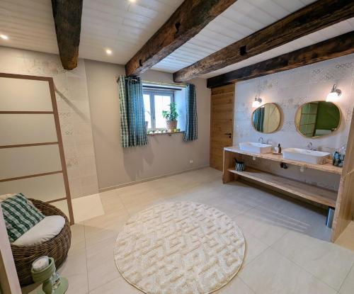 a bathroom with a sink and a mirror at Gite L étable du Bien Etre in Ray-sur-Saône