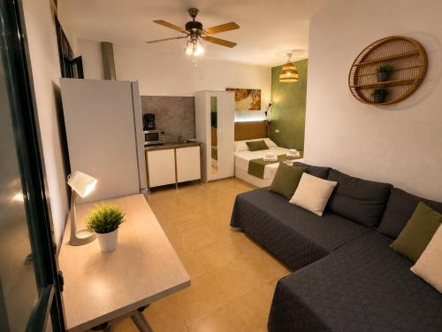 a living room with a couch and a table at Lupe Mediterranean Loft,150m from the Beach Blanes Center in Blanes