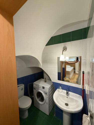 a bathroom with a washing machine and a sink at Lupe Mediterranean Loft,150m from the Beach Blanes Center in Blanes
