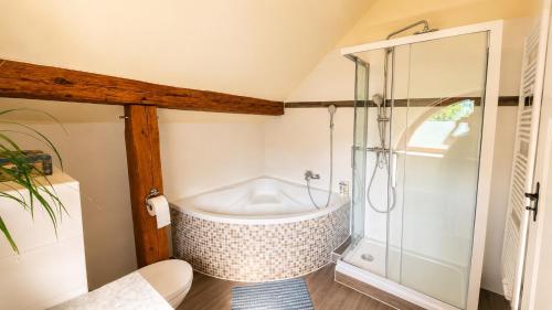 a bathroom with a shower and a tub at Pauline 3 in Templin
