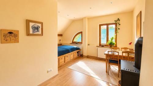 a bedroom with a bed and a dining table at Pauline 3 in Templin