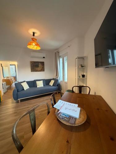 a living room with a table and a couch at Stresa Complex LevOasi in Stresa