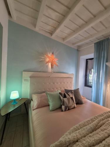 a bedroom with a bed with a star on the wall at PapalePapale Home in Viterbo