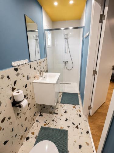 a bathroom with a toilet and a sink and a shower at Mini Studio N6 private Bathroom and Kitchenette in Limassol