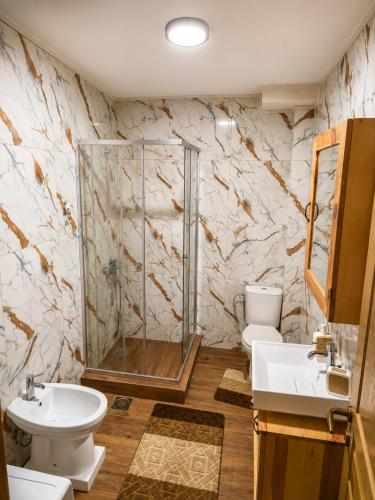 a bathroom with two sinks and a shower at Gacka Luxury Mountain Villa in Feratovo Polje