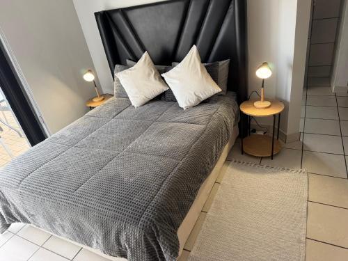 a bedroom with a large bed with two lamps at The Gather Inn Bethlehem in Bethlehem