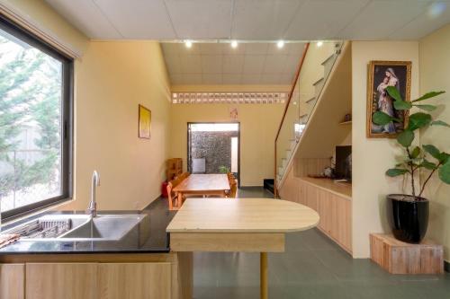 a kitchen with a sink and a counter top at DaLaHa City in Da Lat