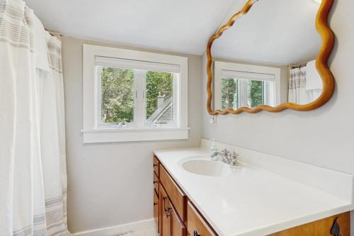a bathroom with a sink and a mirror at Quechee's Cloud 9 in Hartford