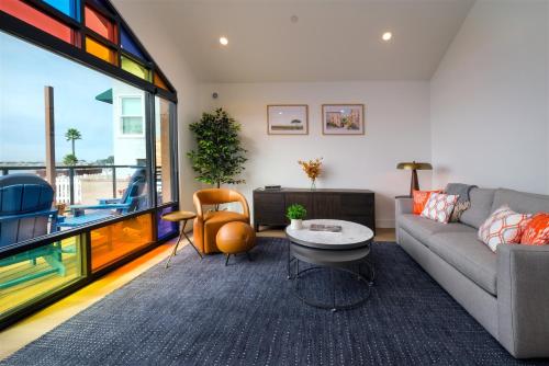 a living room with a couch and a table at Harbor View 101 in Morro Bay