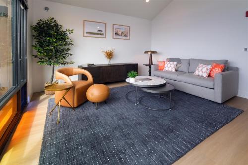 a living room with a couch and a table at Harbor View 101 in Morro Bay