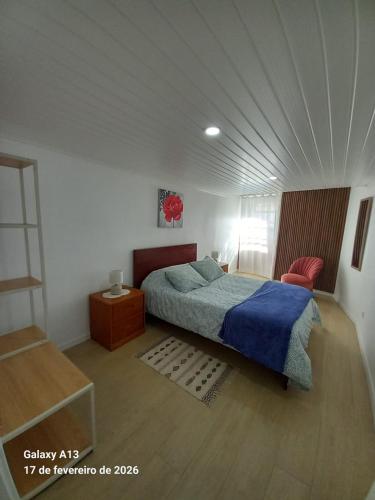 a bedroom with a bed and a white ceiling at Apartamento do Chico in Terra Chã