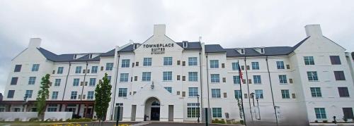 a large white building with a black roof at TownePlace Suites by Marriott Collierville Memphis in Collierville