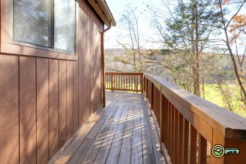 a wooden balcony of a house with a window at Villa #8 in Basye
