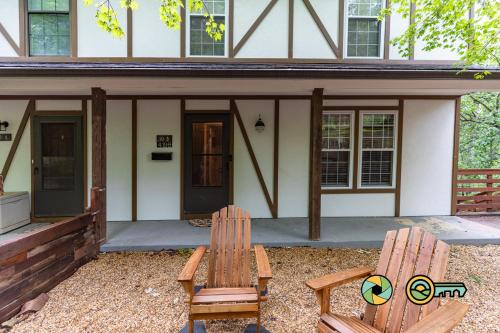 two chairs sitting in front of a house at Lakeview 10B: Forest Den in Basye