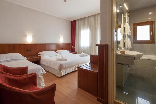 Postel nebo postele na pokoji v ubytování Hotel Antico Mulino