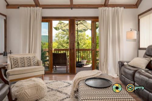 a living room with a couch and a chair at The Hill T-19: Eagle's Nest in Basye